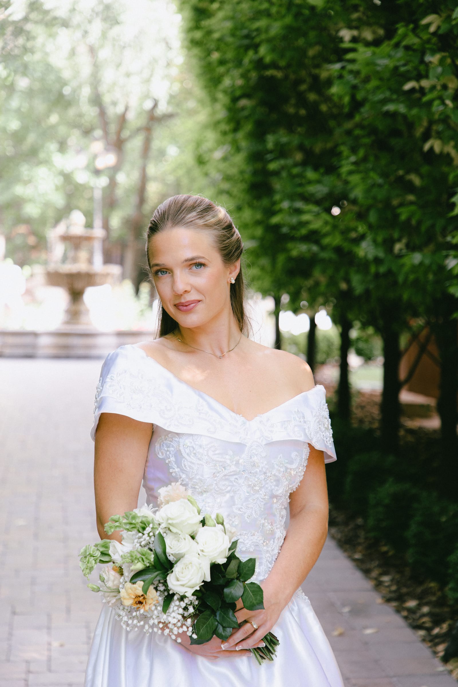 Kyle and Marita wedding at Bellissimo Gardens, the bride with her bouquet