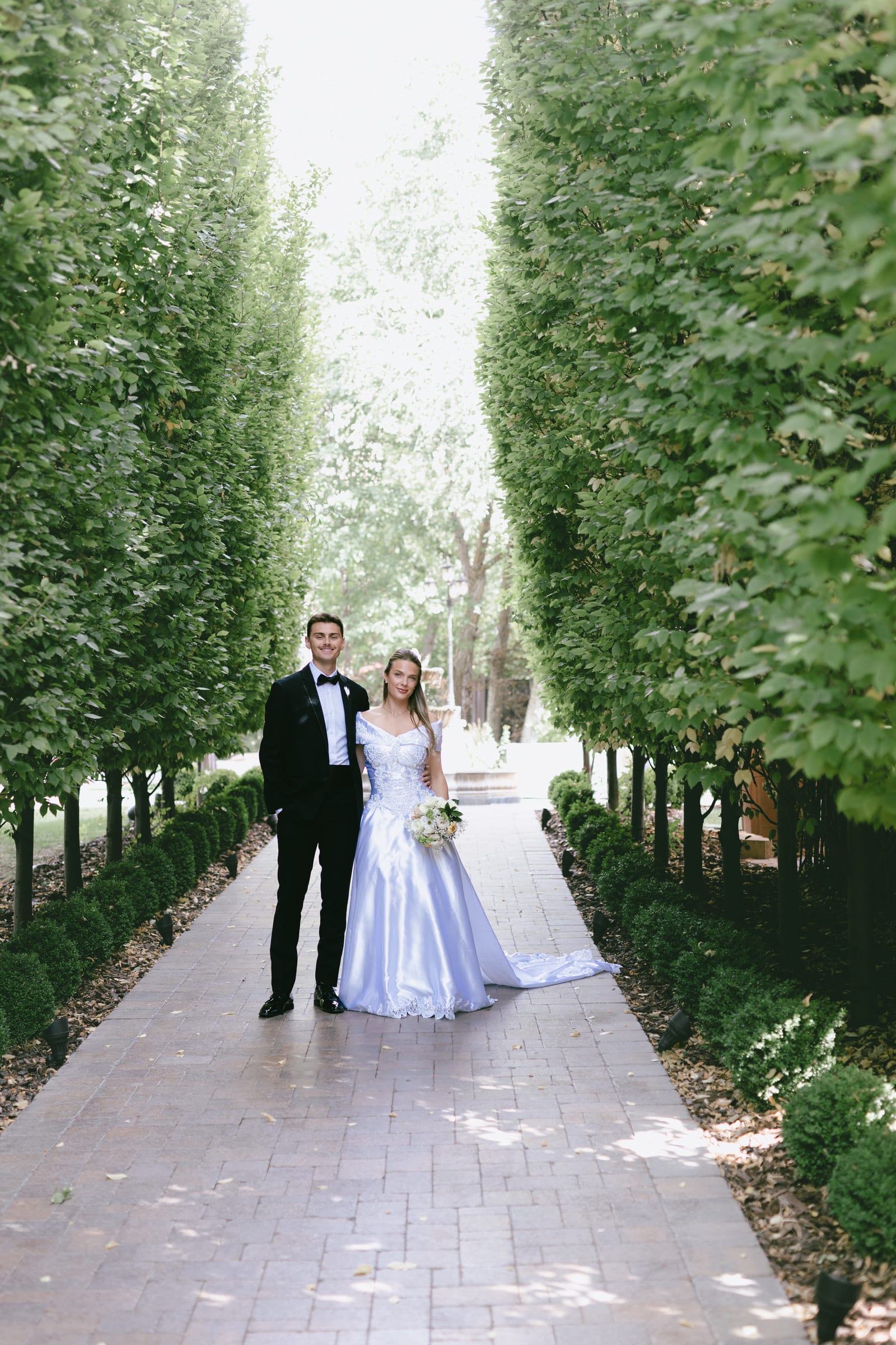 Kyle and Marita wedding at Bellissimo Gardens, the bride with her bouquet