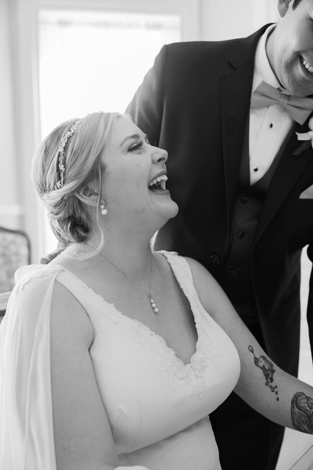 Signing the marriage license, the bride laughing, Eldredge Manor