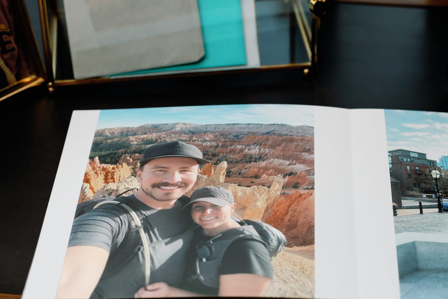 The open guest album with the couple's photograph, Sundance mountain wedding