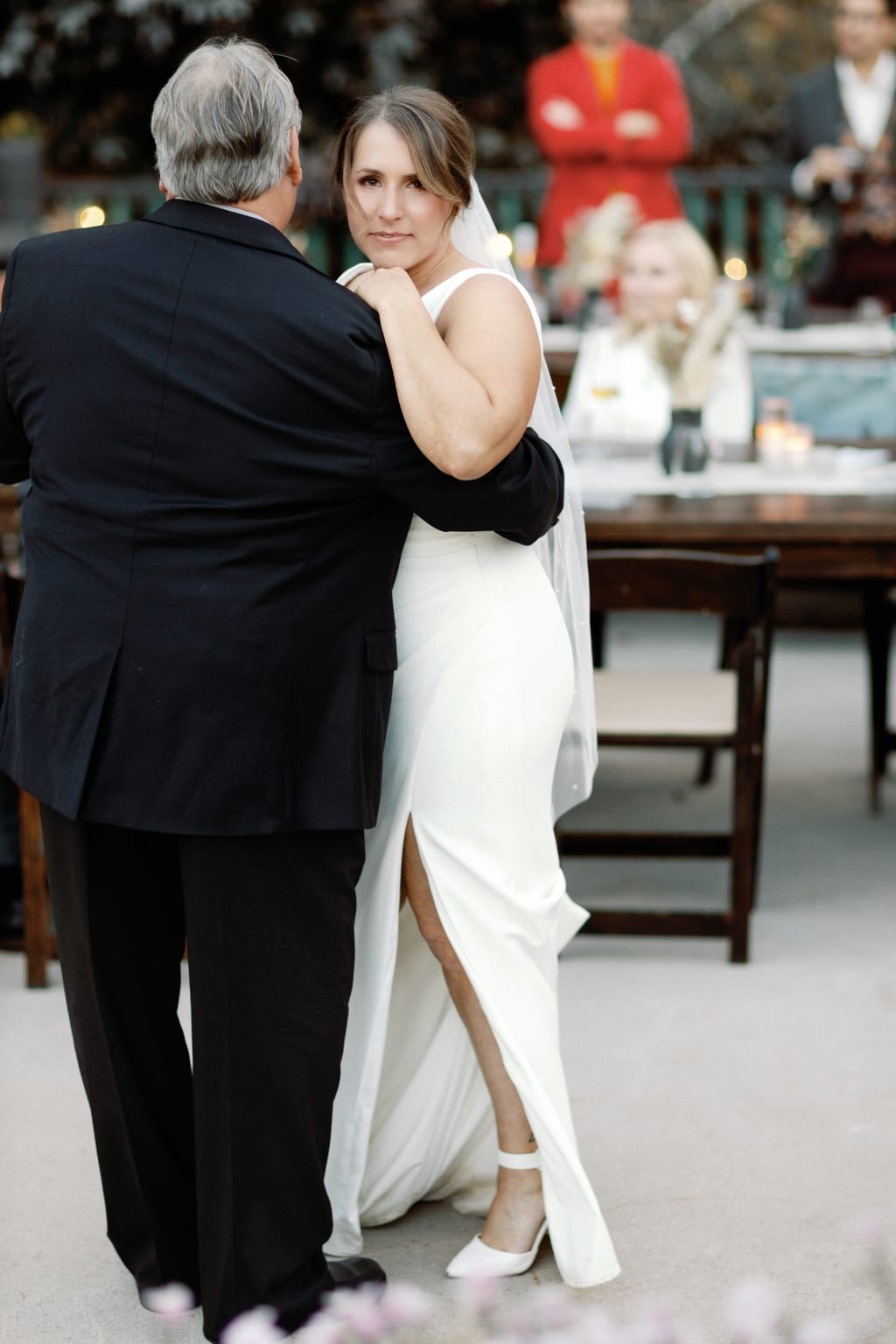 The bride's father kisses her cheek during their dance, Sundance, Utah